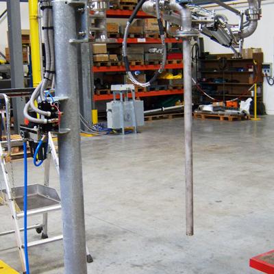 Variable-reach drum loading arm, Pacquet